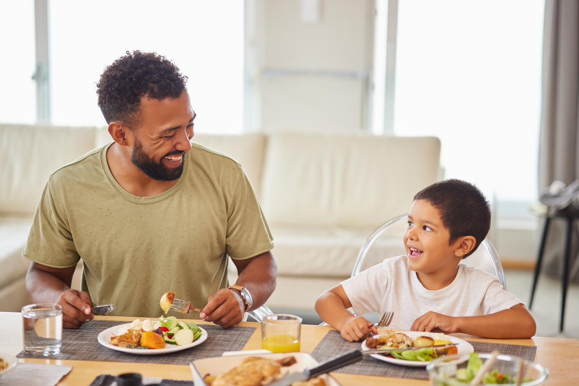 Family enjoying dinner together with no phones at the table